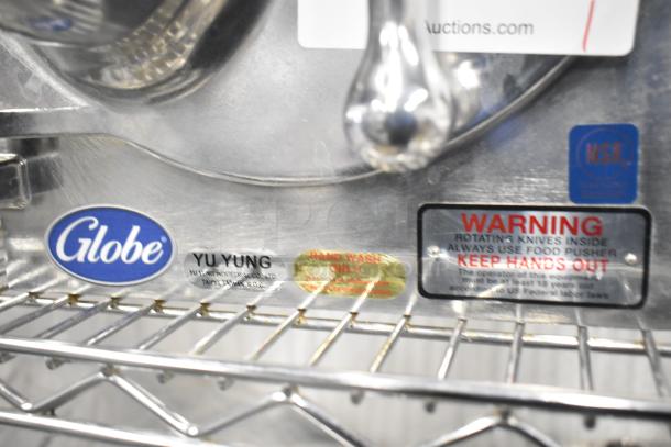 BRAND NEW Globe metal commercial pelican head with blade frame, no blade. Includes warning labels and Globe logo.