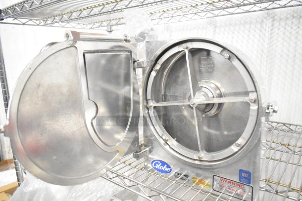 Brand new Globe metal commercial pelican head with blade frame, no blade, on a metal shelf. Visible Globe logo and warning labels.