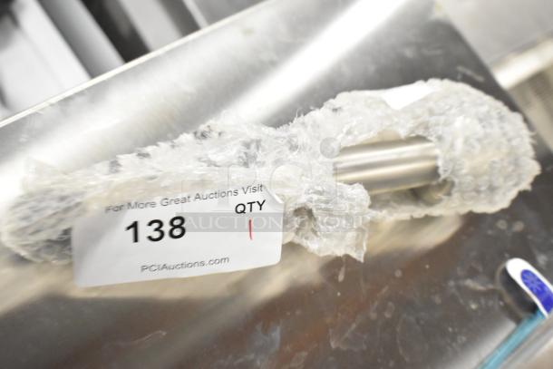 Brand new Galaxy 177PIMBL9STK 9" immersion blender shaft, light-duty, partially wrapped in bubble wrap, auction tag 138 visible.