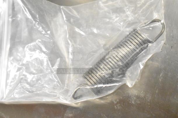 Bagged metal coil, brand new condition, part of five-item auction including thermostatic control and basket.