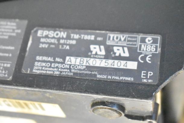 Epson TM-T88II receipt printer, model M129B, 24V, 1.7A, serial ATBK075404, made in Philippines; includes label details.