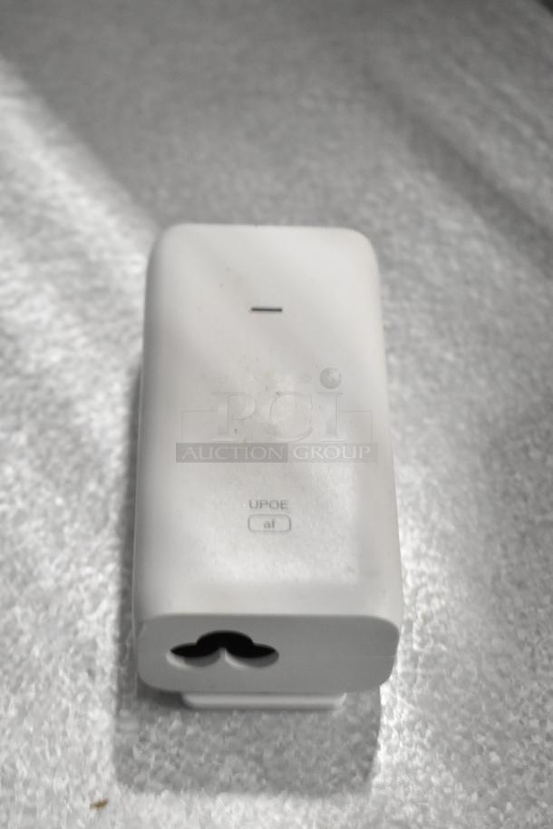 White electronic device with "UPOE" and "af" marking, likely a power adapter. Part of a lot with 5 items including a receipt printer.