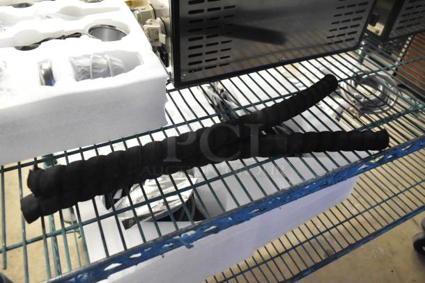 New 2022 La Marzocco Modbar Espresso AV System, undercounter machine on a metal rack. Accessories in foam packaging.