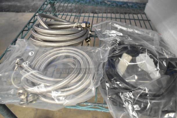 La Marzocco Modbar Espresso AV System cables and hoses, new, in original packaging, on metal shelf.