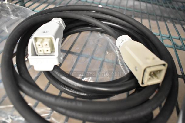 La Marzocco Modbar MR. 10 EB espresso system cable, brand new, black with white connectors, shown on a metal shelf.