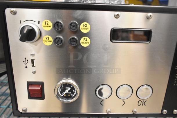 La Marzocco Modbar Espresso AV System, stainless steel panel with dials and pressure gauge. USB port and labeled buttons visible.