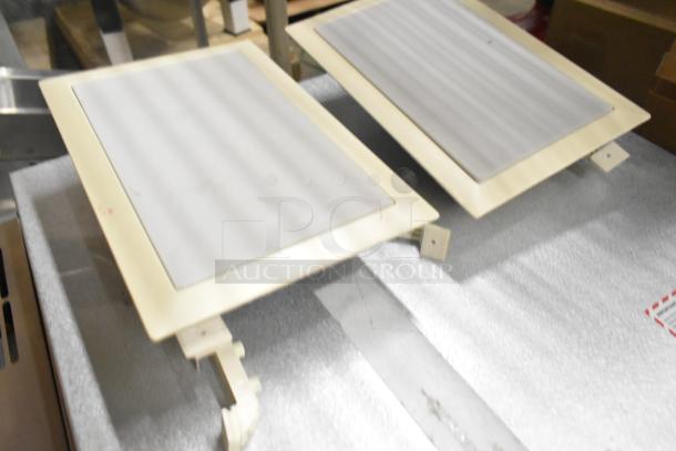 Pair of Control 126WT in-wall loudspeakers, beige frames, pristine condition. Ideal for integrated audio systems.