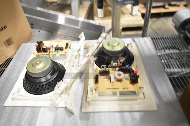 2 Control 126WT in-wall loudspeakers with visible components, good condition, auction includes bid multiplier.