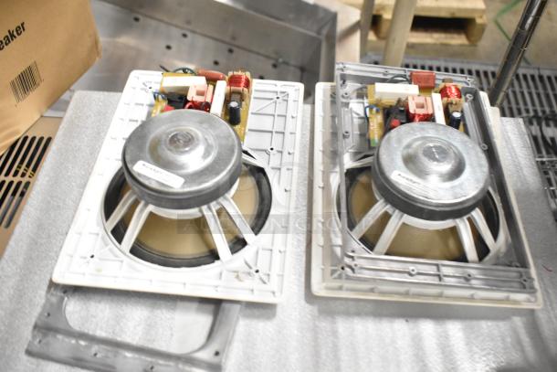 Pair of Control 126WT in-wall loudspeakers, featuring durable construction and visible wiring components, in good condition.