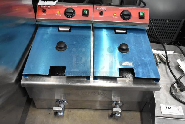 Brand new Avantco F202 dual tank fryer, 30 lb capacity, with 2 metal lids and baskets, 208-240V, minor scratches.