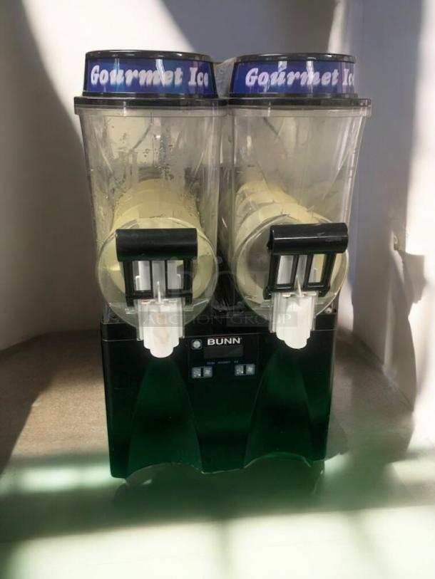 Taylor 340 frozen beverage machine in superb condition, dual dispensers, tested working, 208/230V. "Gourmet Ice" labels.