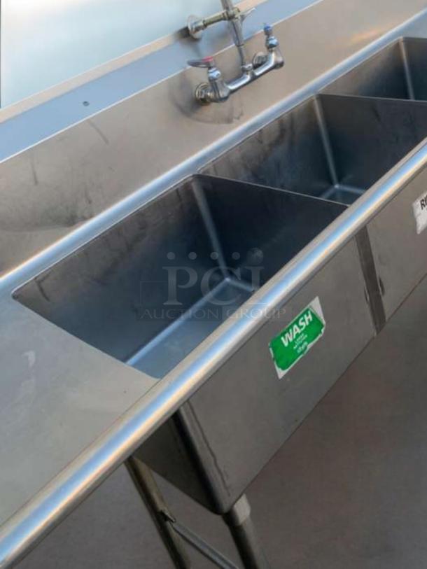 Stainless steel 3-compartment commercial sink with pre-rinse sprayer, prime condition, Heavy Duty brand, fully tested.
