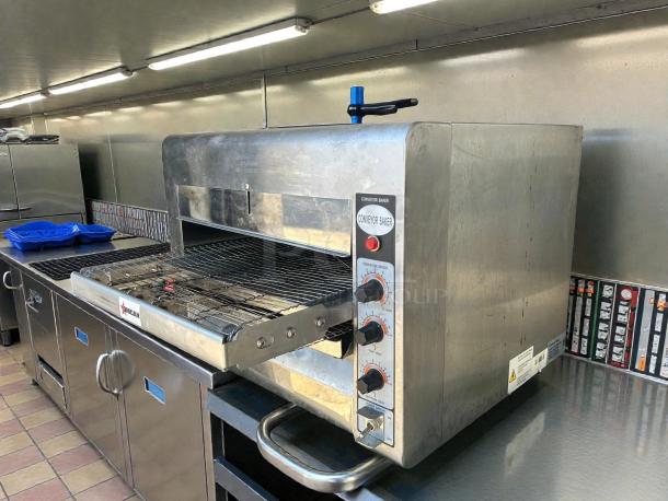 Omcan 41" electric countertop conveyor pizza oven, model 11387, in excellent condition. Tested and working, 240v/1ph.