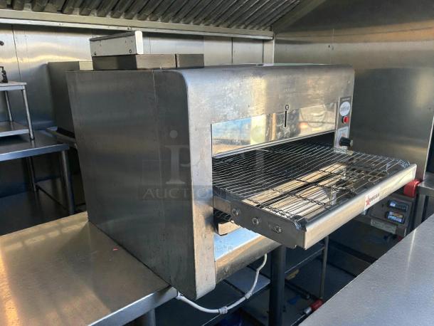 Omcan 41" electric countertop conveyor pizza oven, model 11387, in excellent condition. Tested and working, 240v/1ph.