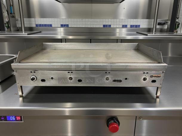 Jade Range 48" gas griddle, model JGT-2448, in excellent condition. Features 1" steel plate, thermostatic controls, tested and working.