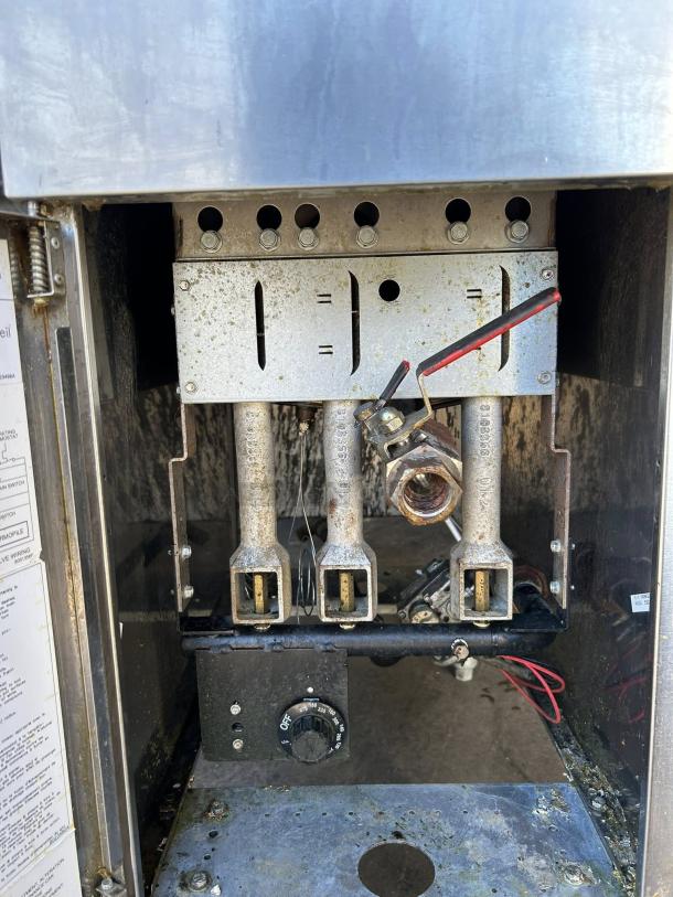 Frymaster ESG35T fryer interior, showing burners, control knob, and wiring. Well-maintained, functioning propane 35 lb. fryer.