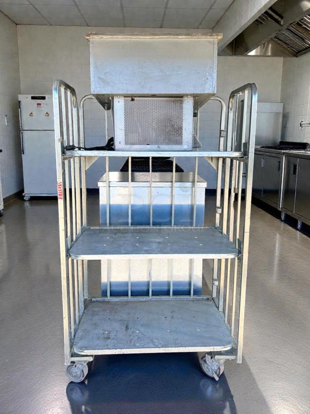 Global Industrial 3-tier shelving on casters, 1,000 lb capacity, metal construction, tested, used condition, rollable.