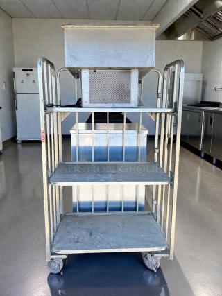 Global Industrial 3-tier shelving on casters, 1,000 lb capacity, metal construction, tested, used condition, rollable.