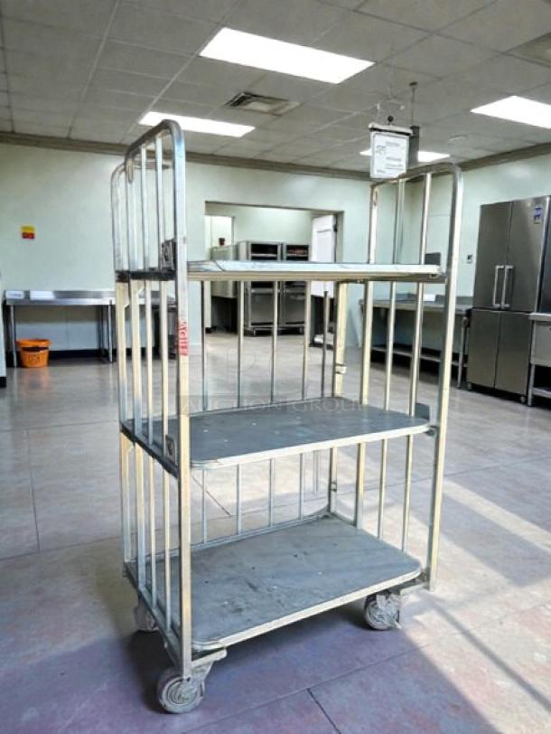 Global Industrial 3-tier shelving on casters, 1,000 lb capacity, tested and working, metal frame, gray shelves, used condition.