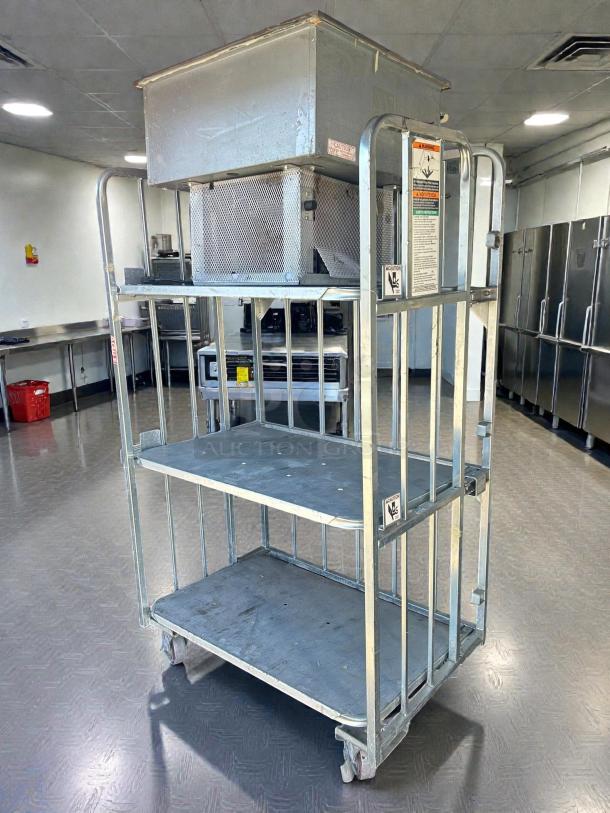 Global Industrial 3-tier shelving with 1,000 lb capacity, on casters, tested and working, visible safety labels, metal construction.