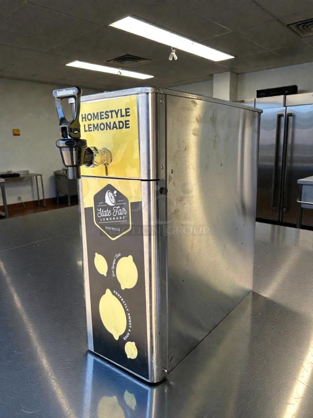 Newco FPM-1 Tea Front Load Post Mix Dispenser, great condition, stainless steel, tested working, labeled "Homestyle Lemonade."