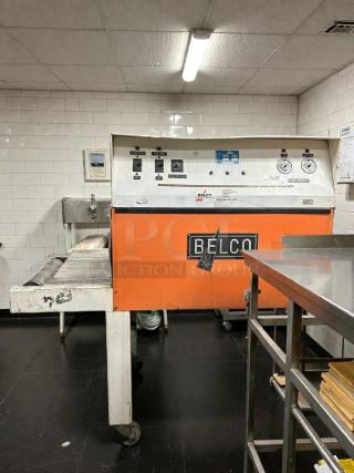 Belco shrink tunnel model ST Serial 4428, tested and working, 220V 1-Phase, features conveyor controls, metal frame, orange finish.