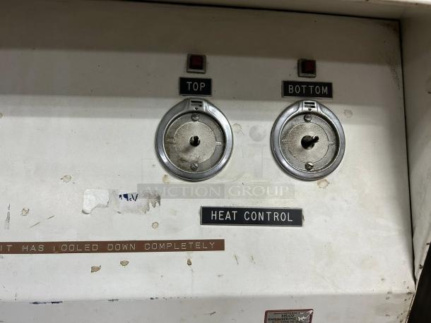 Belco shrink tunnel model ST 4428 control panel showing top and bottom heat control knobs, used condition.