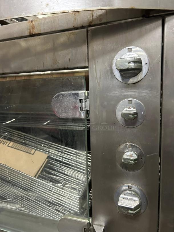Rotisol USA GF975-2G-SS gas rotisserie, 2 spits, 6-bird capacity, stainless steel, tested, working, visible control knobs.