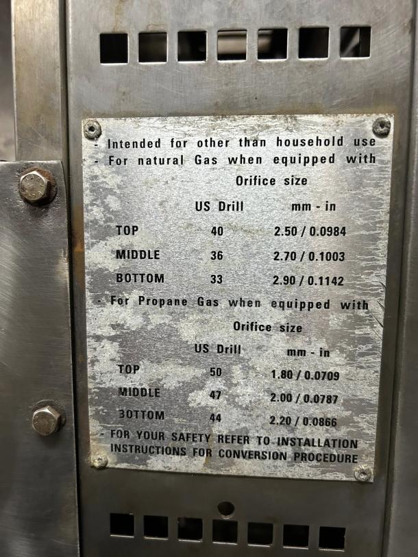 Rotisol USA GF975-2G-SS rotisserie label showing gas orifice sizes for natural and propane gas.