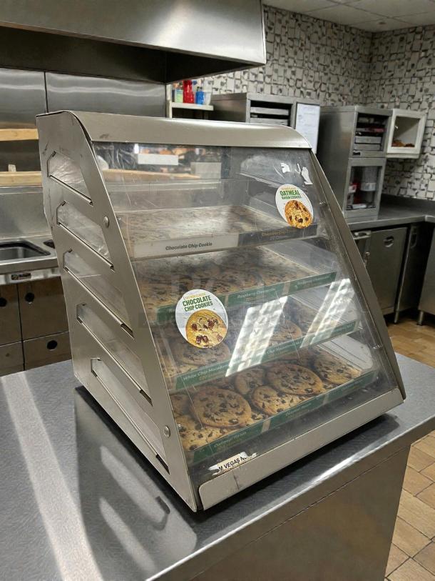 Subway 4-shelf cookie display case, great condition, fully tested. Clear front, visible labels for cookie varieties, commercial use.