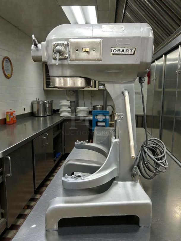 Hobart A200 20 QT dough mixer in good condition, silver finish, 115V single phase, tested and working, ideal for bakery use.