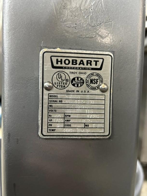 Hobart A200 mixer label showing model, serial number, voltage, and specifications. 20 QT capacity, tested and working.