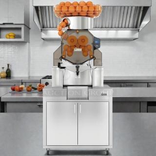 Citrocasa 8000 XB Advance Citrus Juicer in great condition, with visible components and contrasting backdrop.