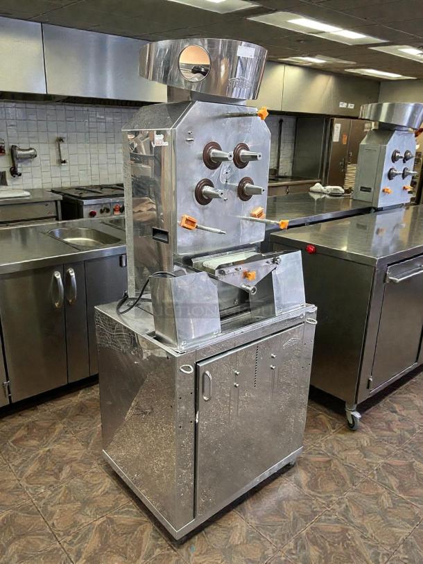 Citrocasa 8000 XB Advance Citrus Juicer in great condition. Stainless steel body, visible logos, "As Is" sale.