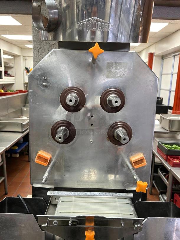 Citrocasa 8000 XB Advance Citrus Juicer, stainless steel, great condition, orange accents, "Citrocasa" label visible.