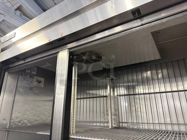 True T-49F-HC reach-in freezer, excellent condition, solid doors, metal shelves. Visible model label and tested sign.