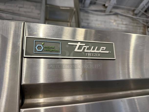True T-49F-HC freezer, stainless steel, 54 1/8" wide, dual solid doors, natural refrigerant label, excellent condition.