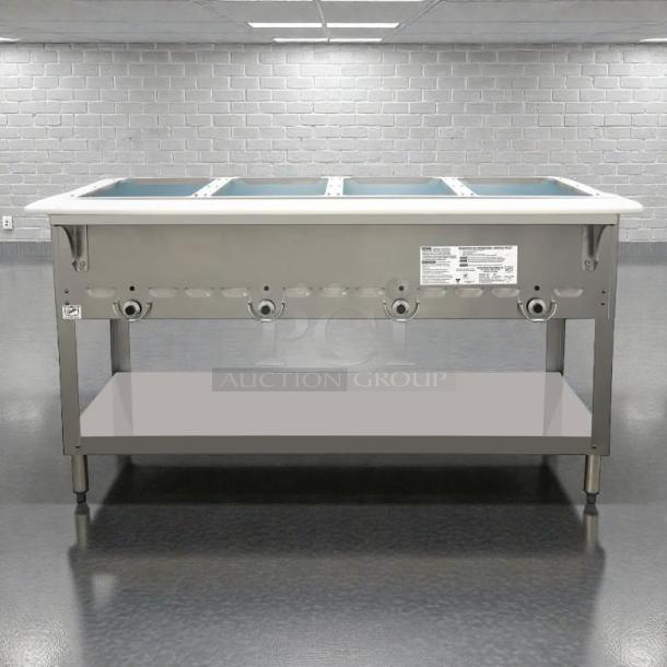 Duke model 304 hot food table, 58 3/8" with 4 wells and cutting board, liquid propane, great condition, includes covers.