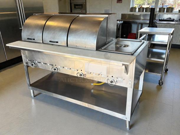 Duke 304 hot food table, 58 3/8", with 4 wells, cutting board, liquid propane, includes covers, excellent condition.