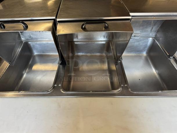 Duke 304 hot food table with 4 wells, cutting board, and covers. Liquid propane. Great condition, tested and working.