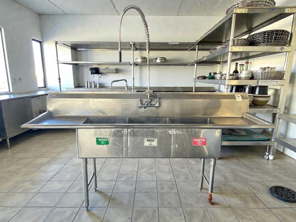 GSW USA SE18183D three-compartment sink with hand spray and faucet, excellent condition, labeled "Wash," "Rinse," "Sanitize."