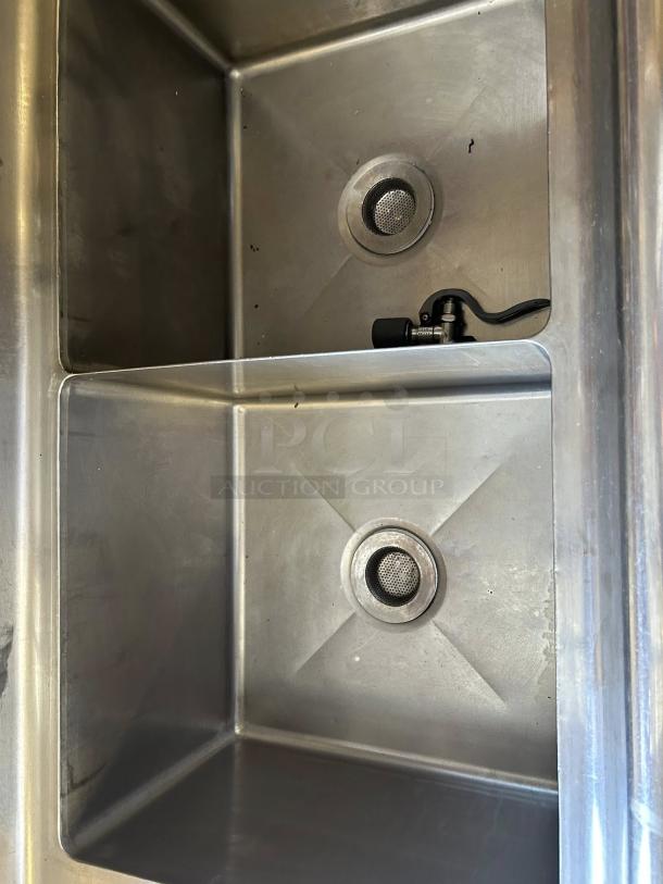 GSW USA SE18183D three-compartment stainless steel sink in excellent condition, featuring hand spray and faucet.