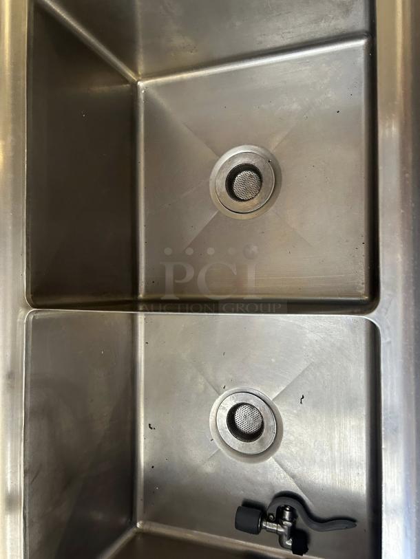 GSW USA SE18183D three-compartment sink with hand spray and faucet in excellent condition. Stainless steel, ideal for commercial use.