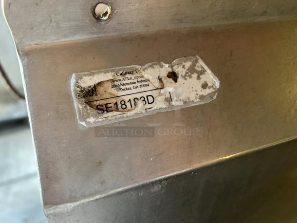Label on GSW USA SE18183D sink showing model information. The label is slightly worn but readable.