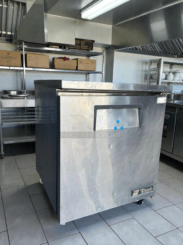 True TUC-27-LP-HC undercounter refrigerator in excellent condition, stainless steel, with visible logo, tested and working.
