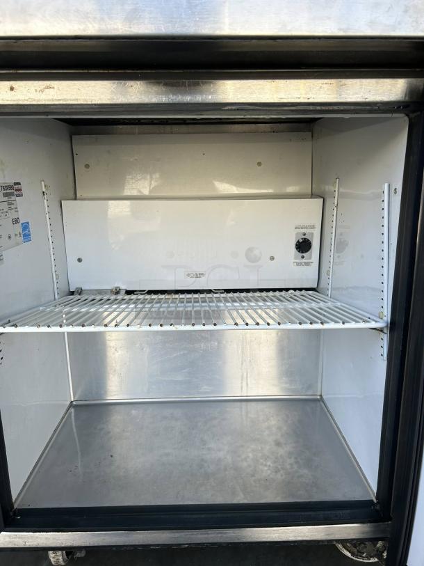 True TUC-27-LP-HC undercounter refrigerator in excellent condition, stainless steel interior, visible labels, tested and working.