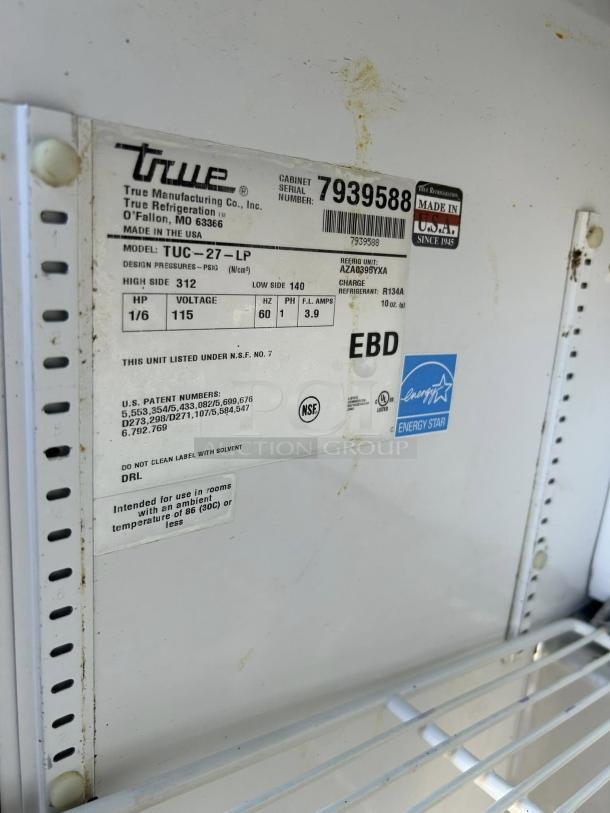 True TUC-27-LP-HC undercounter refrigerator label, model number, and specs shown. Excellent condition, energy-efficient.