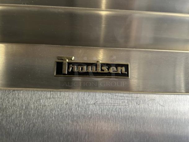 Traulsen G31010 G Series logo on stainless steel surface, indicating model and make of reach-in freezer.