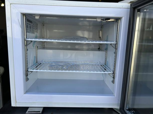 Maxx Cold MXM1-2FHC countertop glass door merchandiser freezer, excellent condition, tested, dual shelves, model label visible.