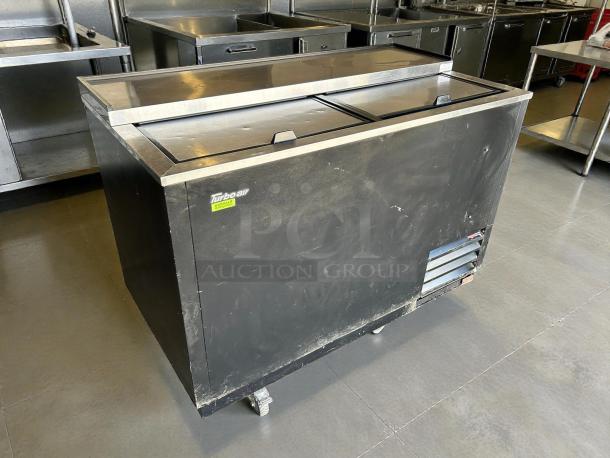Turbo Air TBC-50SB-N6 bottle cooler, black, 50", holds 432 bottles, tested and working, visible Turbo Air logo, used condition.